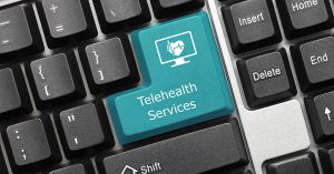 Close-up view on conceptual keyboard - Telehealth Services (blue key); blog: telehealth services